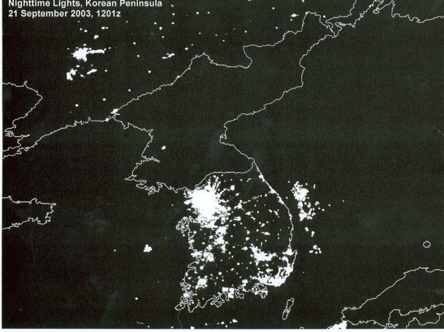 satellite image of the korean penninsula at night, showing city lighting